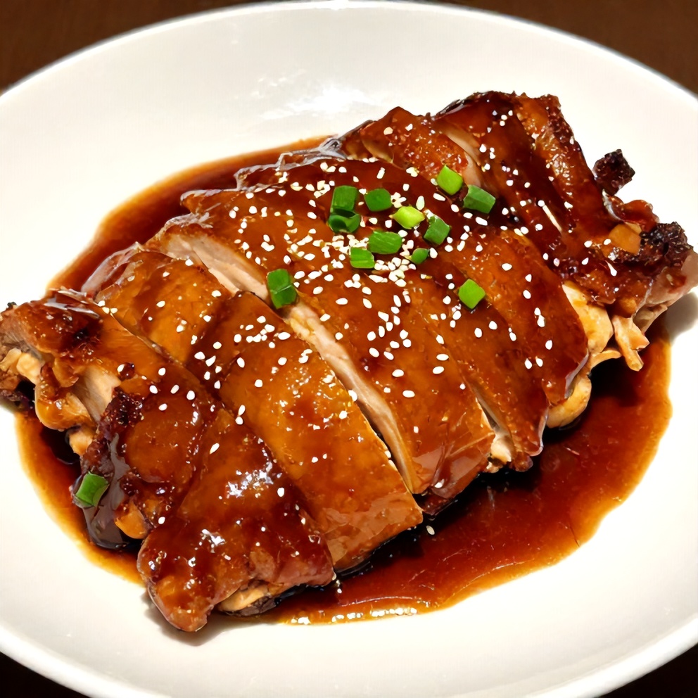 Plated Sticky Char Siu Chicken with green onions