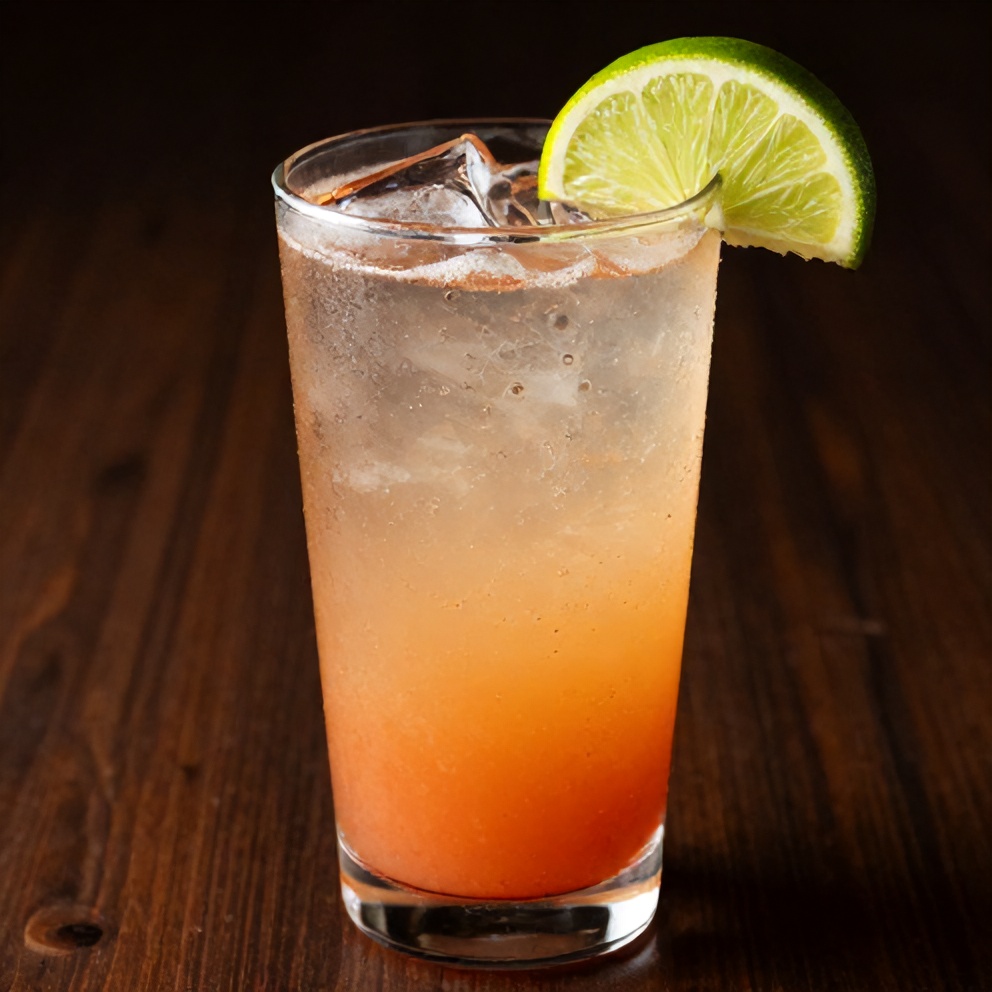 Glass of hibiscus lime sparkling water garnished with lime wheel